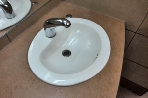 Image of men's bathroom sink in local mall