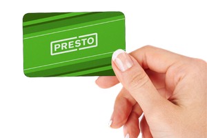 Image of hand holding Presto card