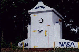 Image of cottage outhouse which looks like a space shuttle